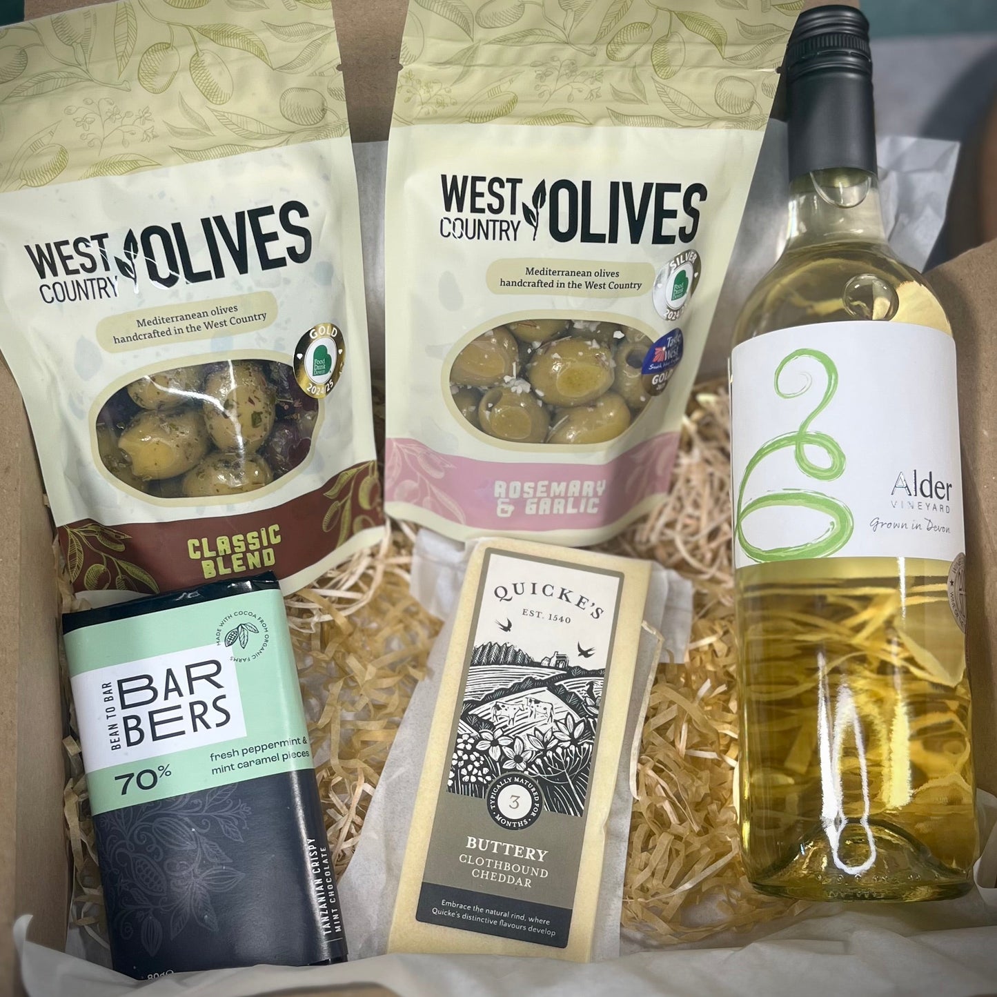 Devon Delight Hamper - Local white wine, quicke's cheddar, mint chocolate and two packs of olives.
