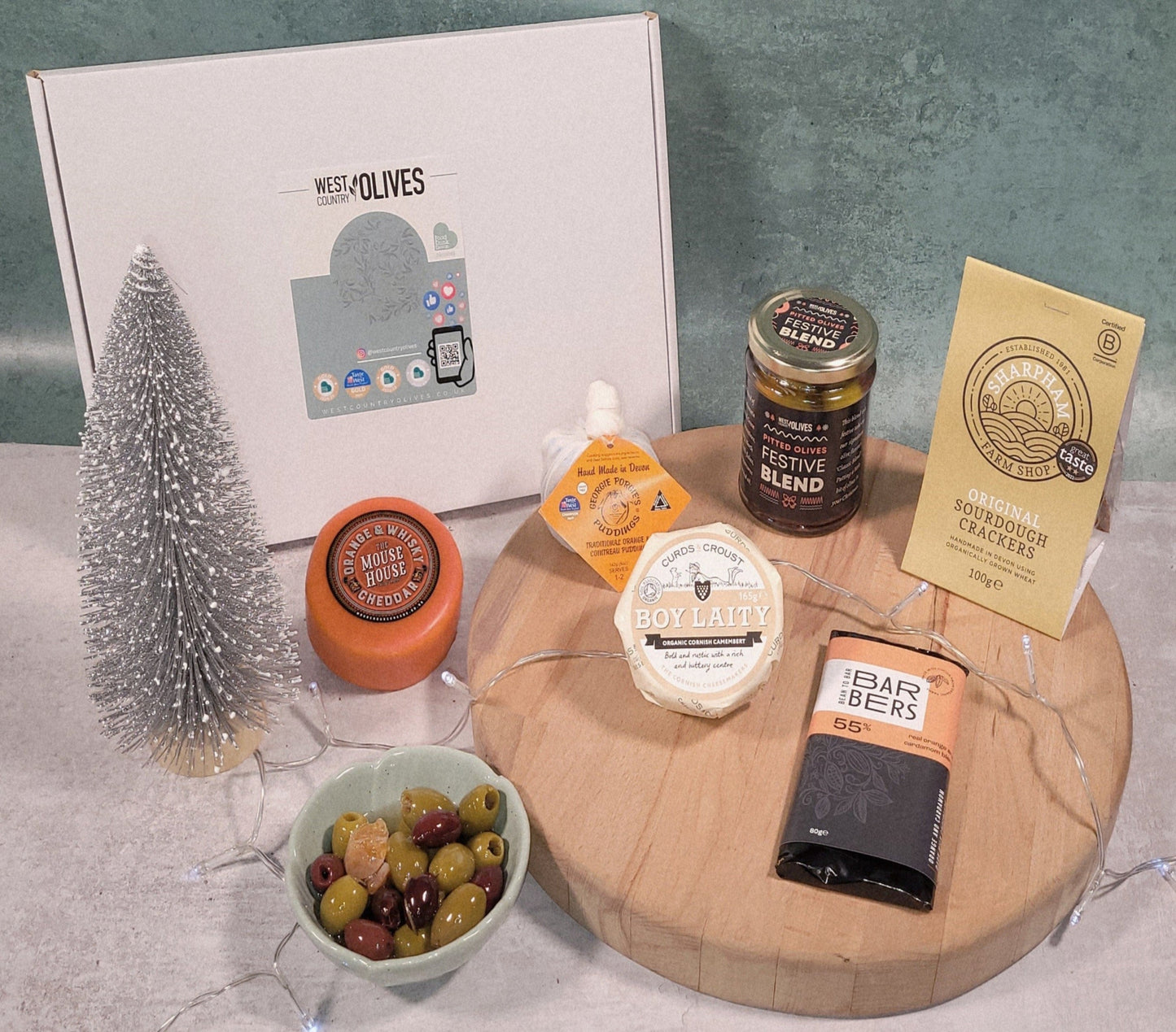 Gourmet food gift hamper, including olives, cheese and chocolate.